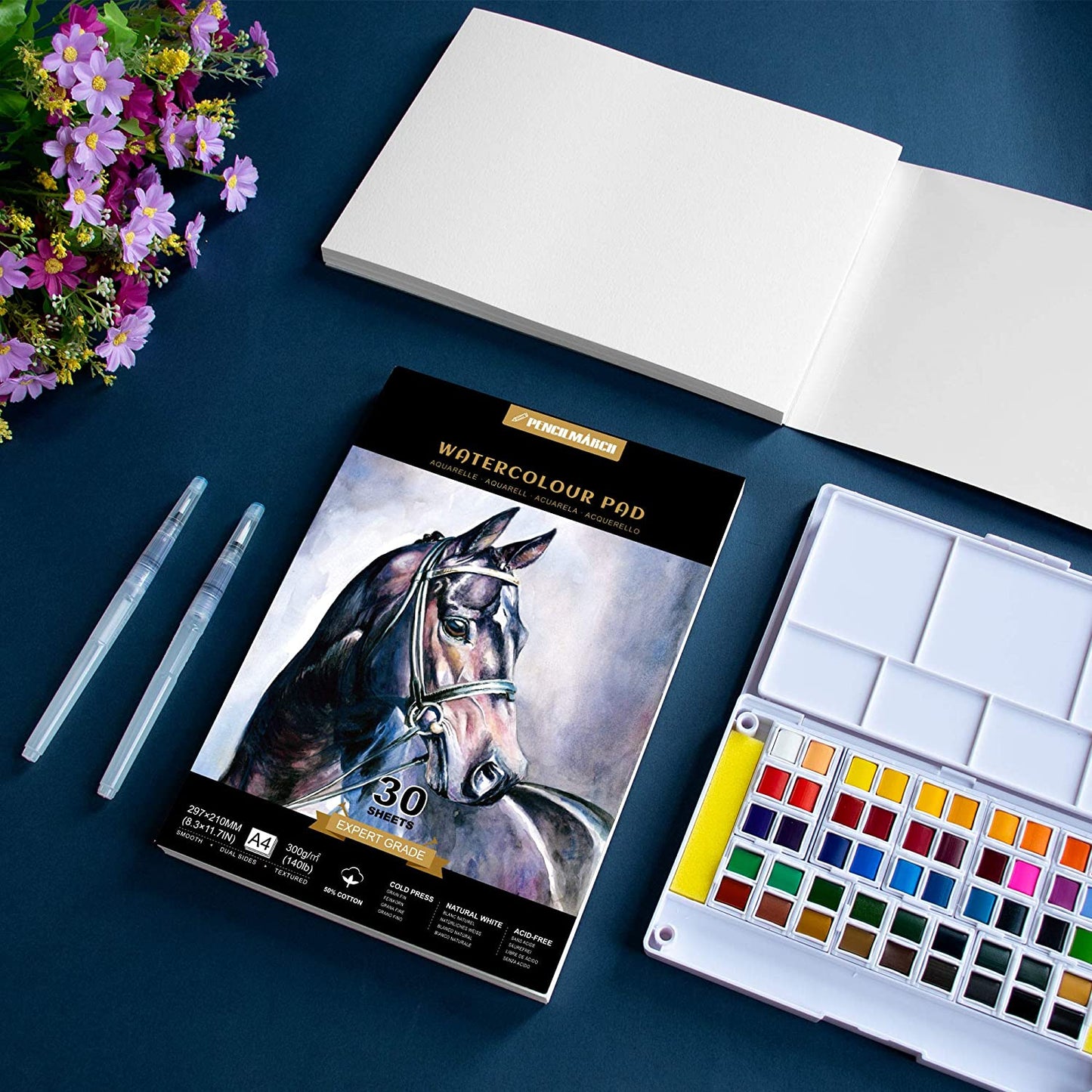 An A4 Pencilmarch artist watercolour paper pad with 300 gsm paper and 30 pages next to a paint palette - Stationery Island