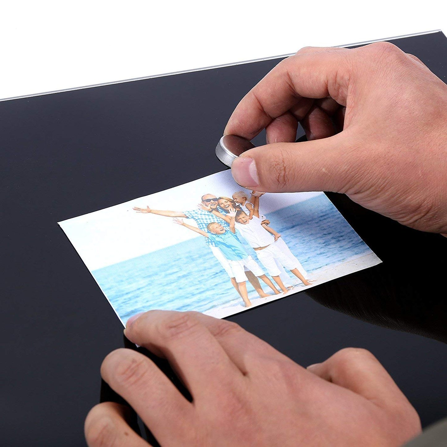 A magnet used to stick a family picture - Stationery Island