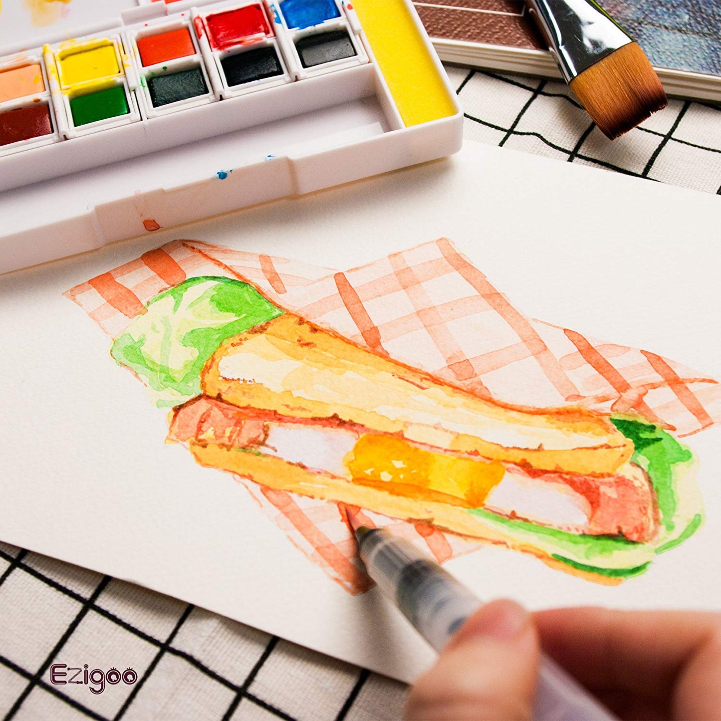 Colours from the Ezigoo watercolour paint set that has 12 colours and an aqua brush, used to paint a sandwich - Stationery Island