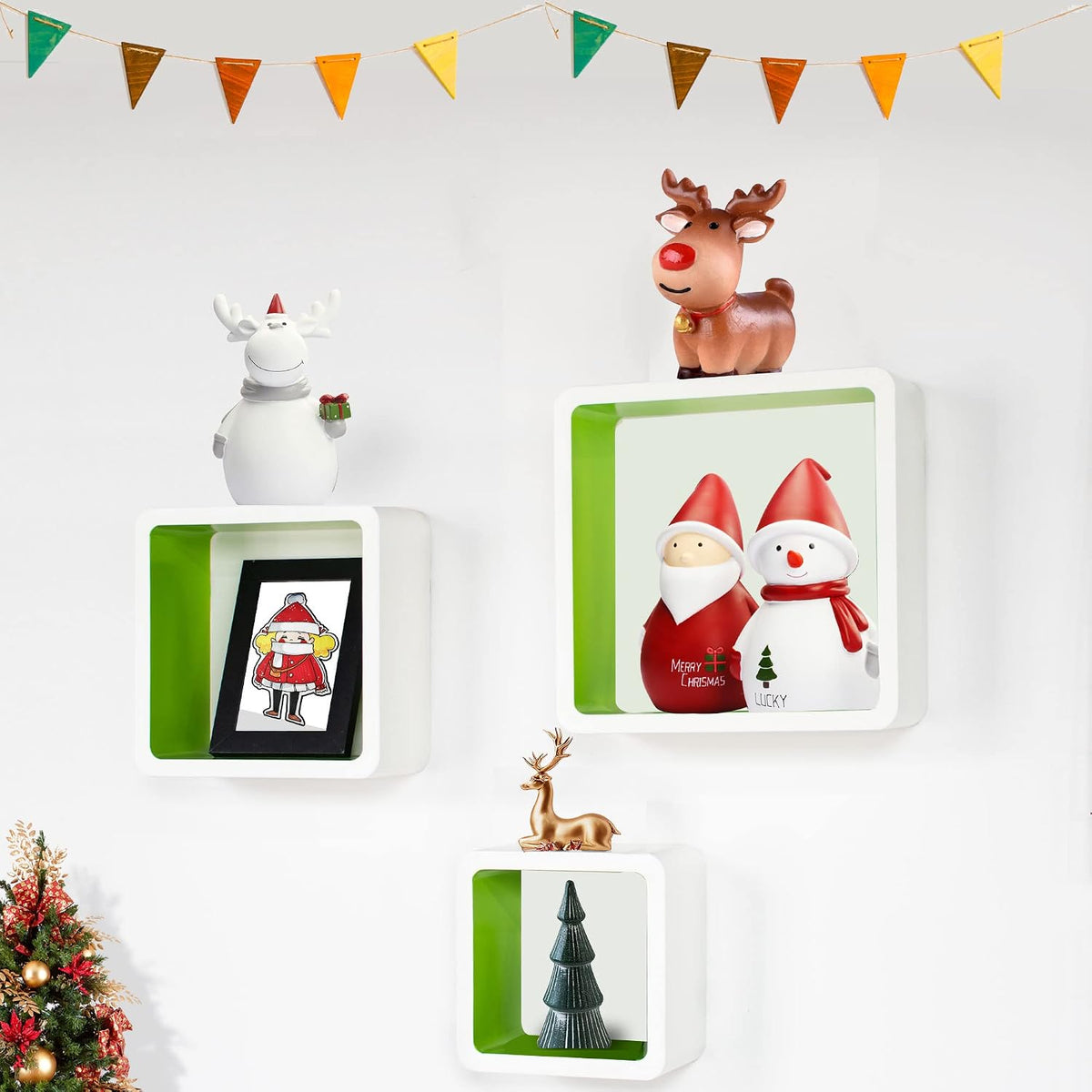 White and grass green cube floating shelves in a room