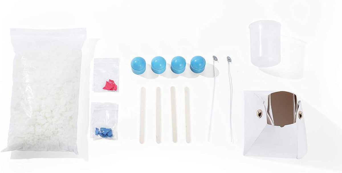 The TBC DIY candle kit project for kids includes 4 wax mystery capsules with metal charms, stones, a fold-up wax paper mould, soy wax, 2 bags of colours chips, 2 metal brads with 2 wicks, 4 wooden stir sticks, a measuring cup and instructions - Stationery Island
