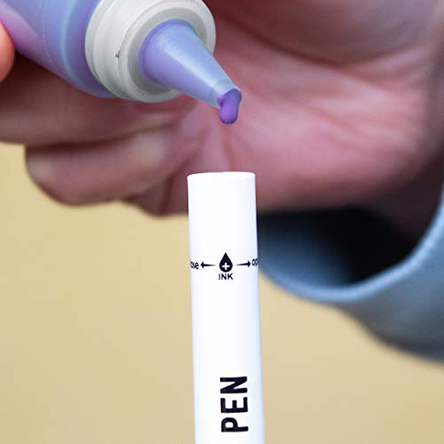 Ink being poured inside a winter colours brush pen - Stationery Island
