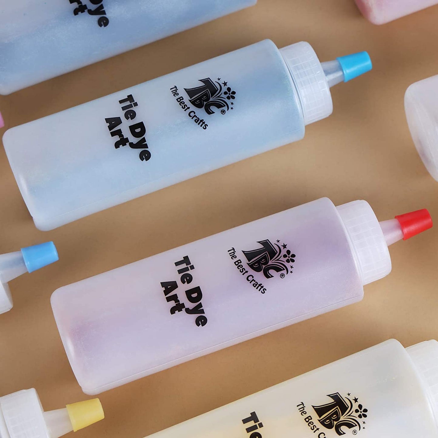 Coloured bottles, with dye inside of the TBC tie dye art party kit - Stationery Island